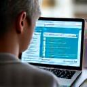 a person looking at a personalized digital wellness plan on a laptop, with data visualizations